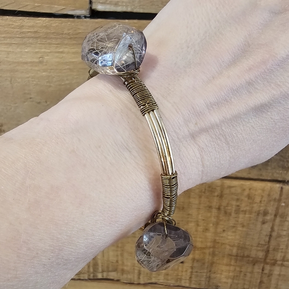 Unsigned Jewelry - Goldtone wire bangle with faceted fiber filled grey beads